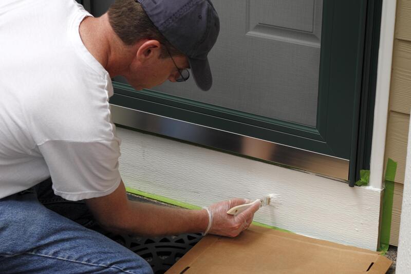 professional painter doing house painting 